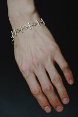 MULTIPLE CROSS SILVER BRACELET