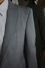 OBJECT DYED UNLINED, VISIBLE MELTLOCK, ELONGATED 2 BUTTON JACKET