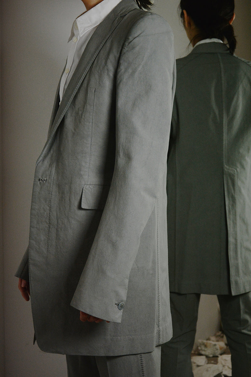 OBJECT DYED UNLINED, VISIBLE MELTLOCK, ELONGATED 2 BUTTON JACKET
